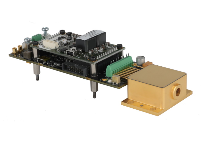 brass or gold colored ultra-compact high heat load laser diode package attached to a two-level OEM circuit board module