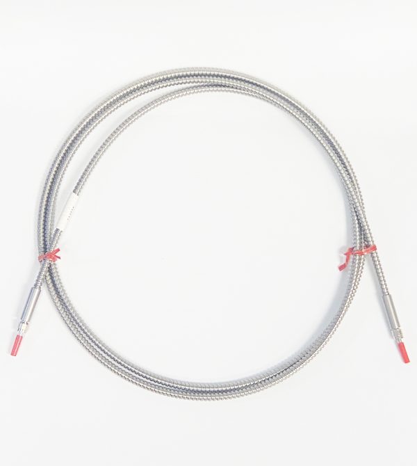 a coiled fiber patch cable, silver colored flexible spiral protective sheath