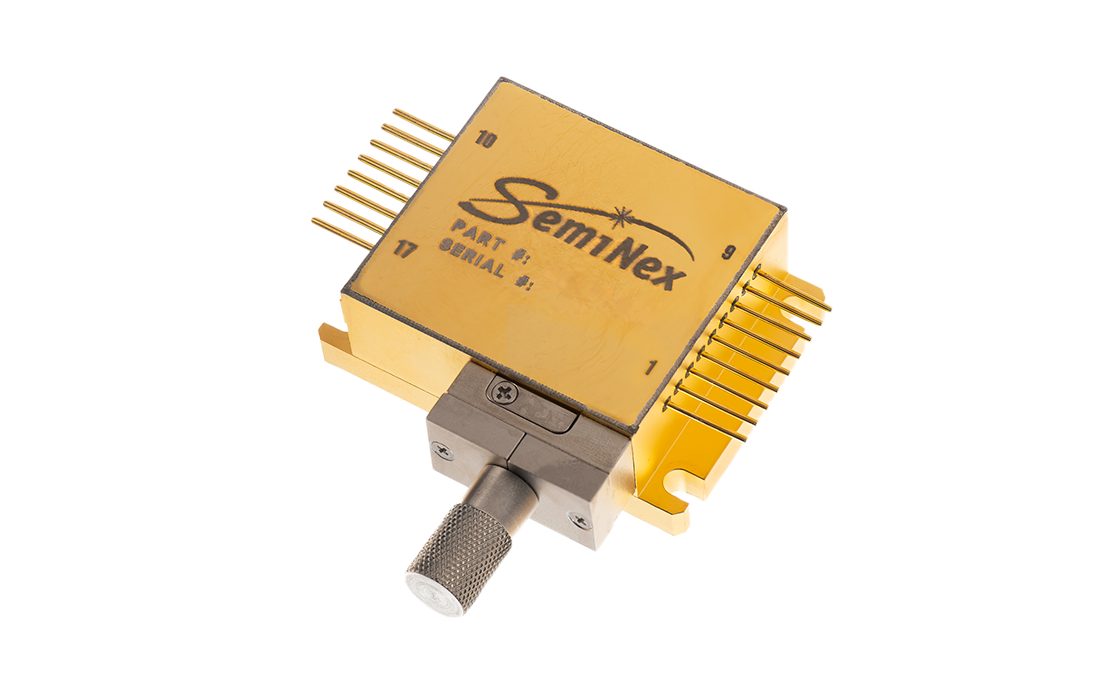 brass colored 4CM laser diode package with electrical pins, output optical fiber and white top label