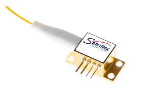 brass colored 4PN laser diode package with electrical pins, output optical fiber and white top label